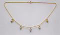 SEELE gold-tone chain necklace with five dangling marquise-cut clear crystal charms, full front view.