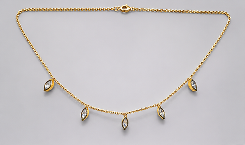 SEELE gold-tone chain necklace with five dangling marquise-cut clear crystal charms, full front view.