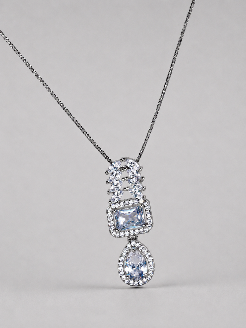SEELE elegant crystal cascade pendant necklace with rectangular center and pear-shaped drop