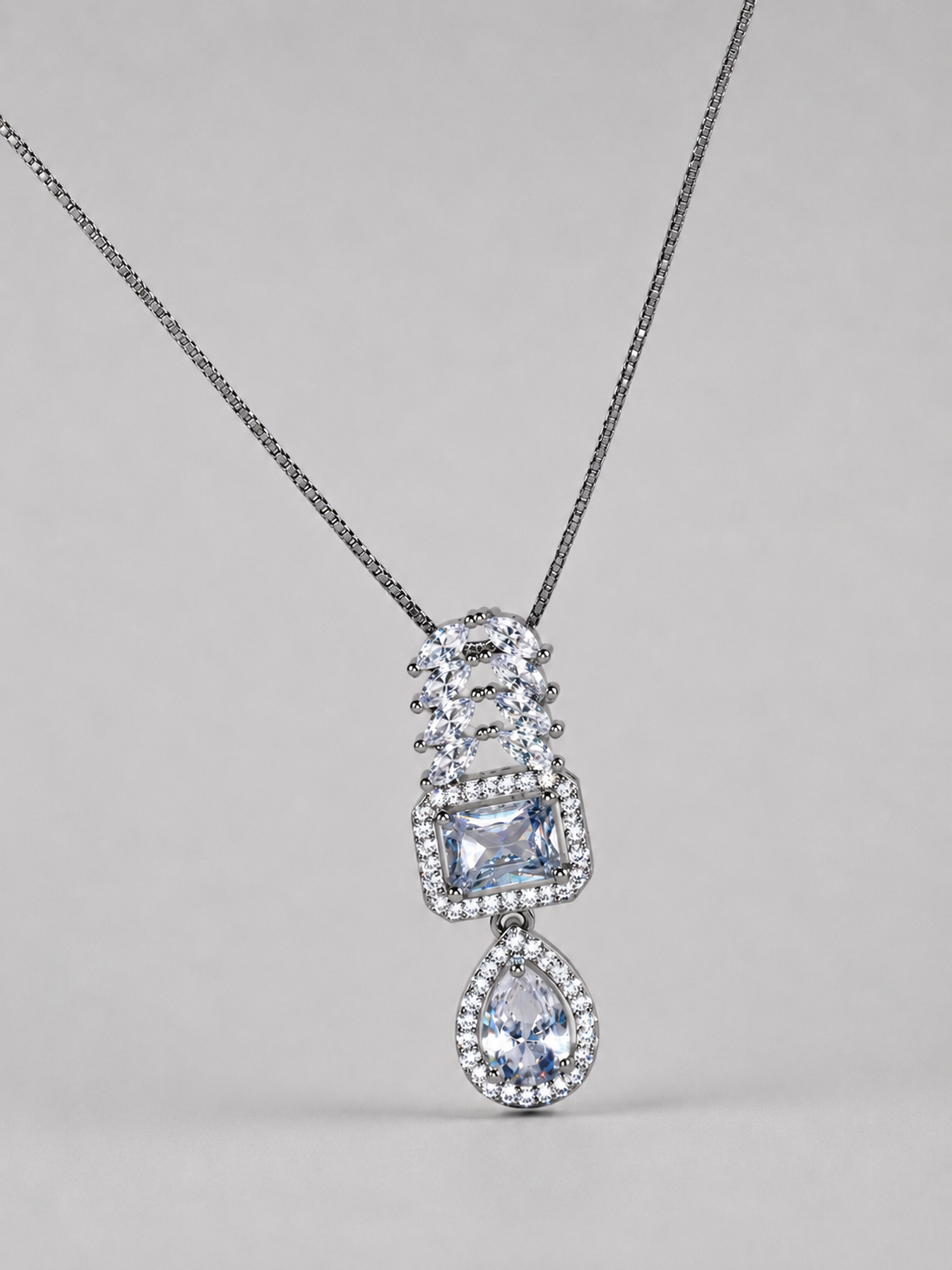SEELE elegant crystal cascade pendant necklace with rectangular center and pear-shaped drop