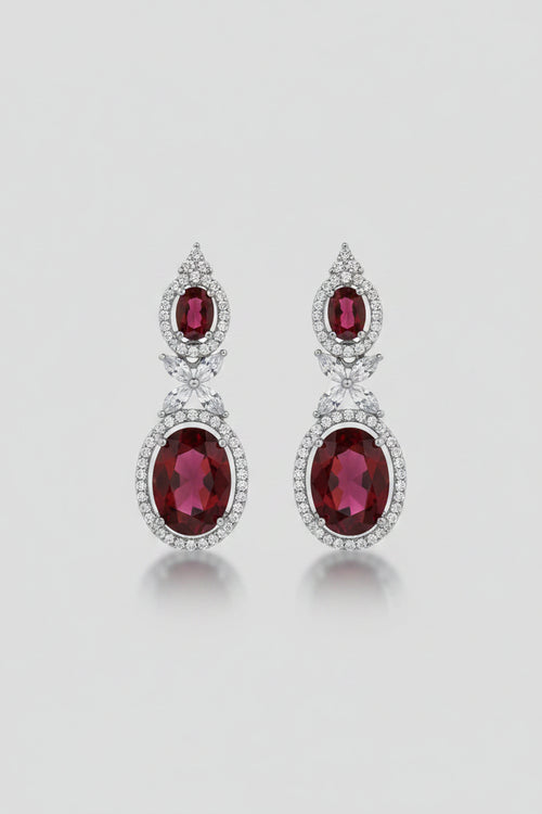 SEELE Crimson Halo Drop Earrings — deep red oval zircon drops with clear stone halo on silver base